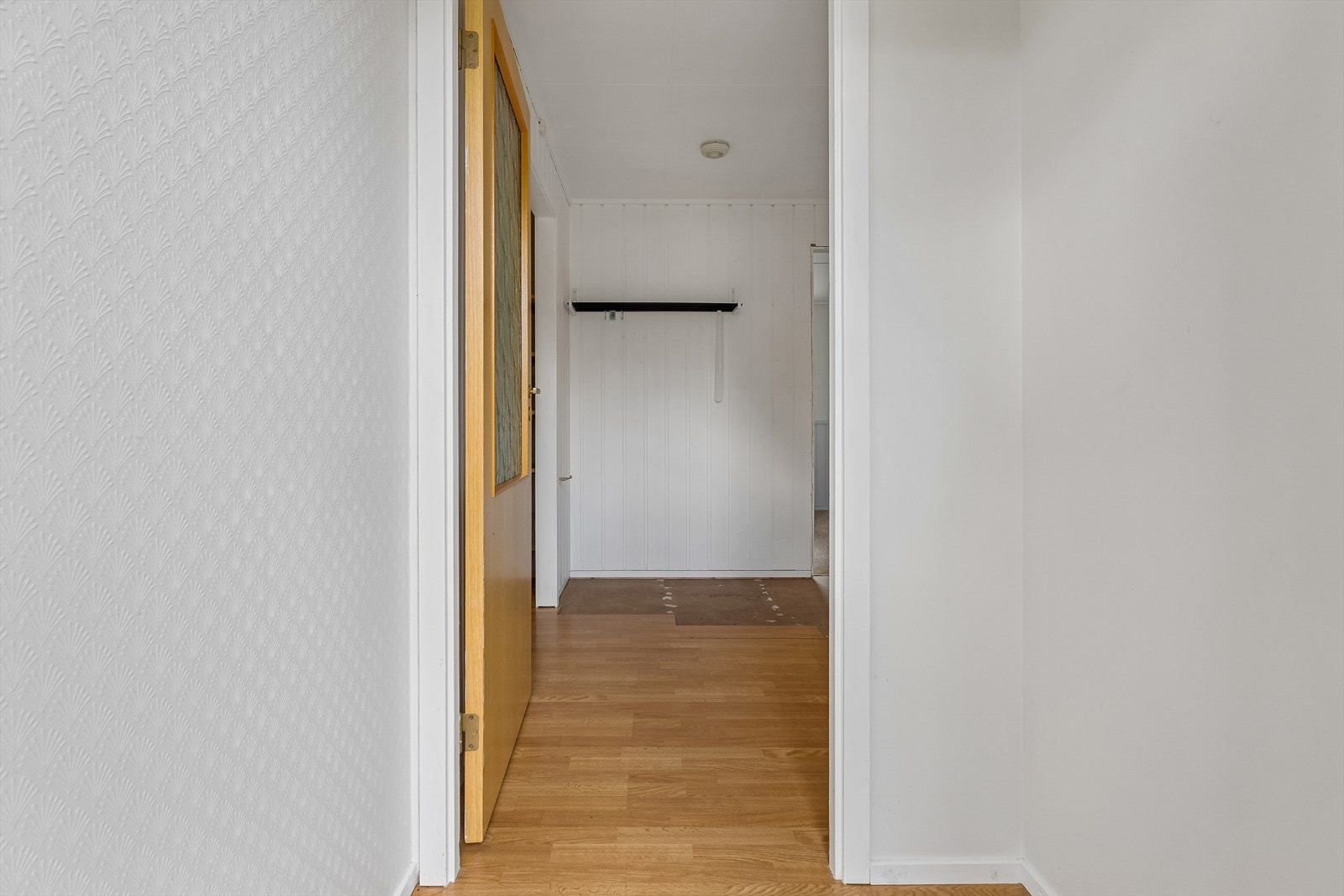 Entréen leder inn til boligens første etasje. Galleribilde