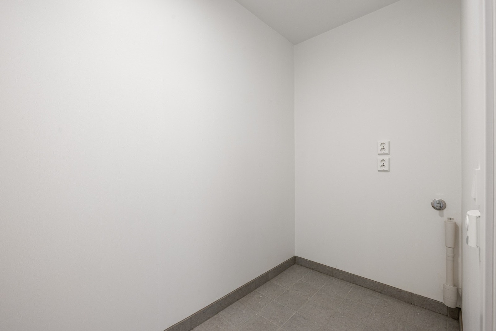 Leiligheten har et eget praktisk vaskerom. Galleribilde