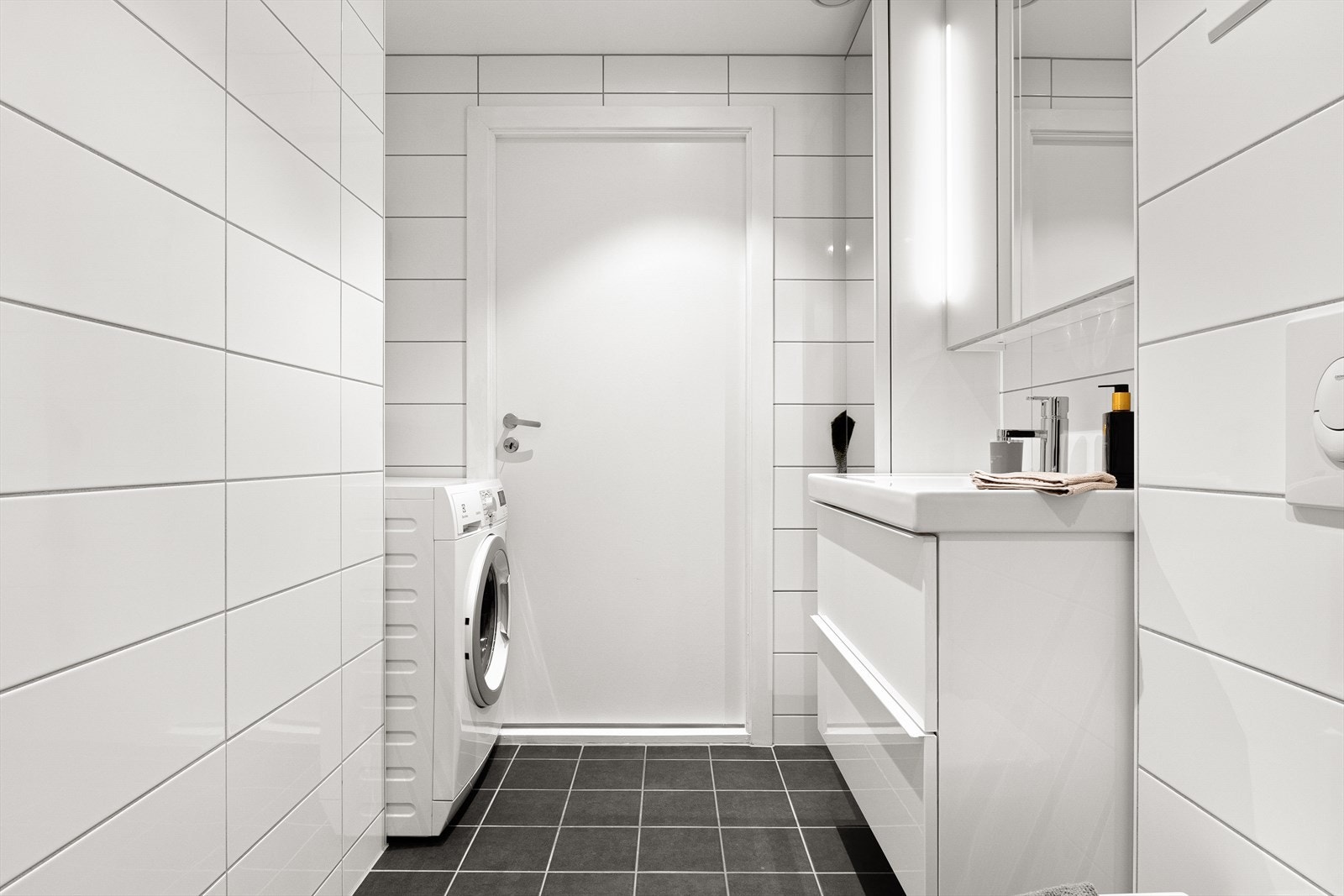 Badet har opplegg for vaskemaskin. Galleribilde