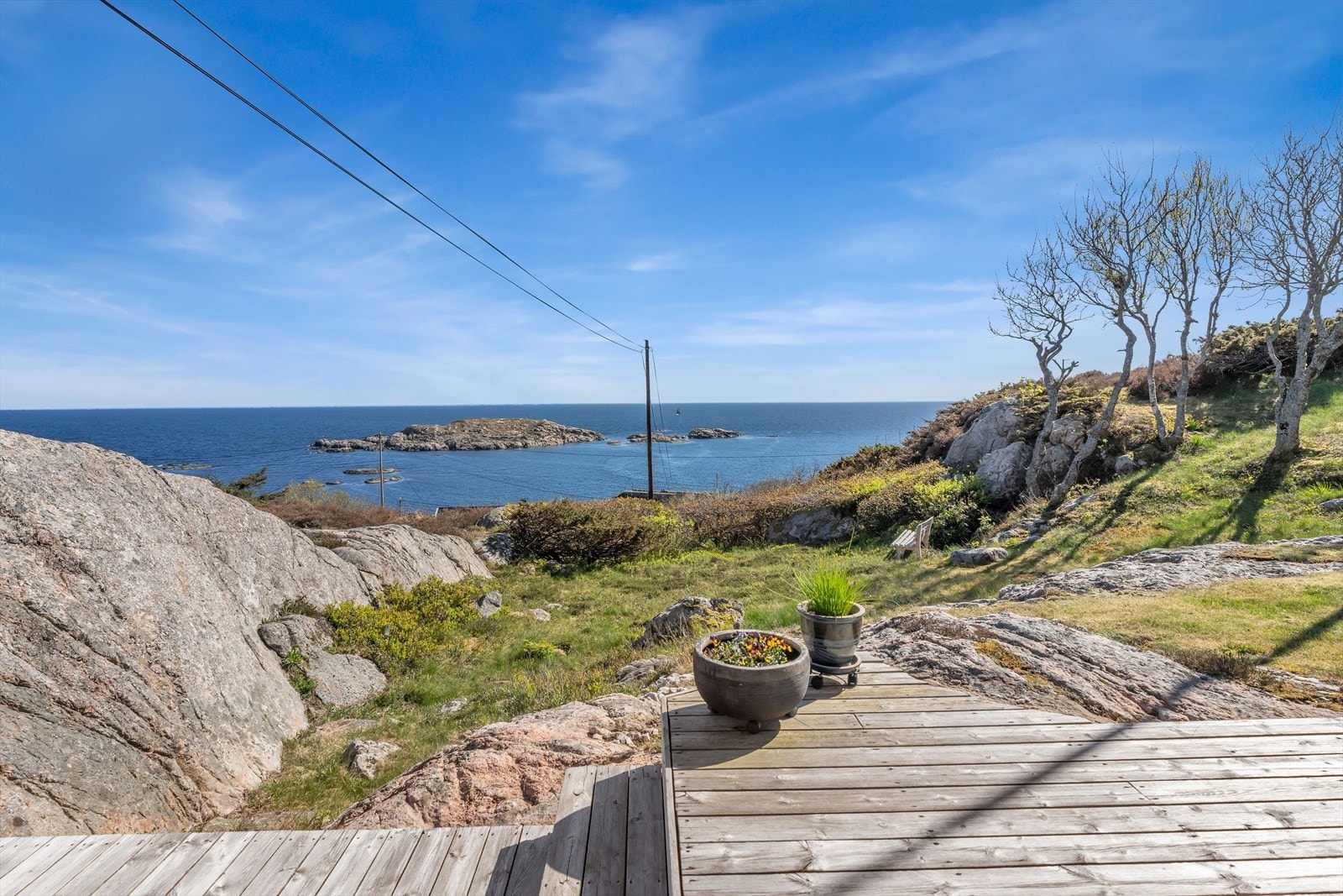 Den storslåtte utsikten over havet og skjærgården er en sentral del av opplevelsen. Galleribilde