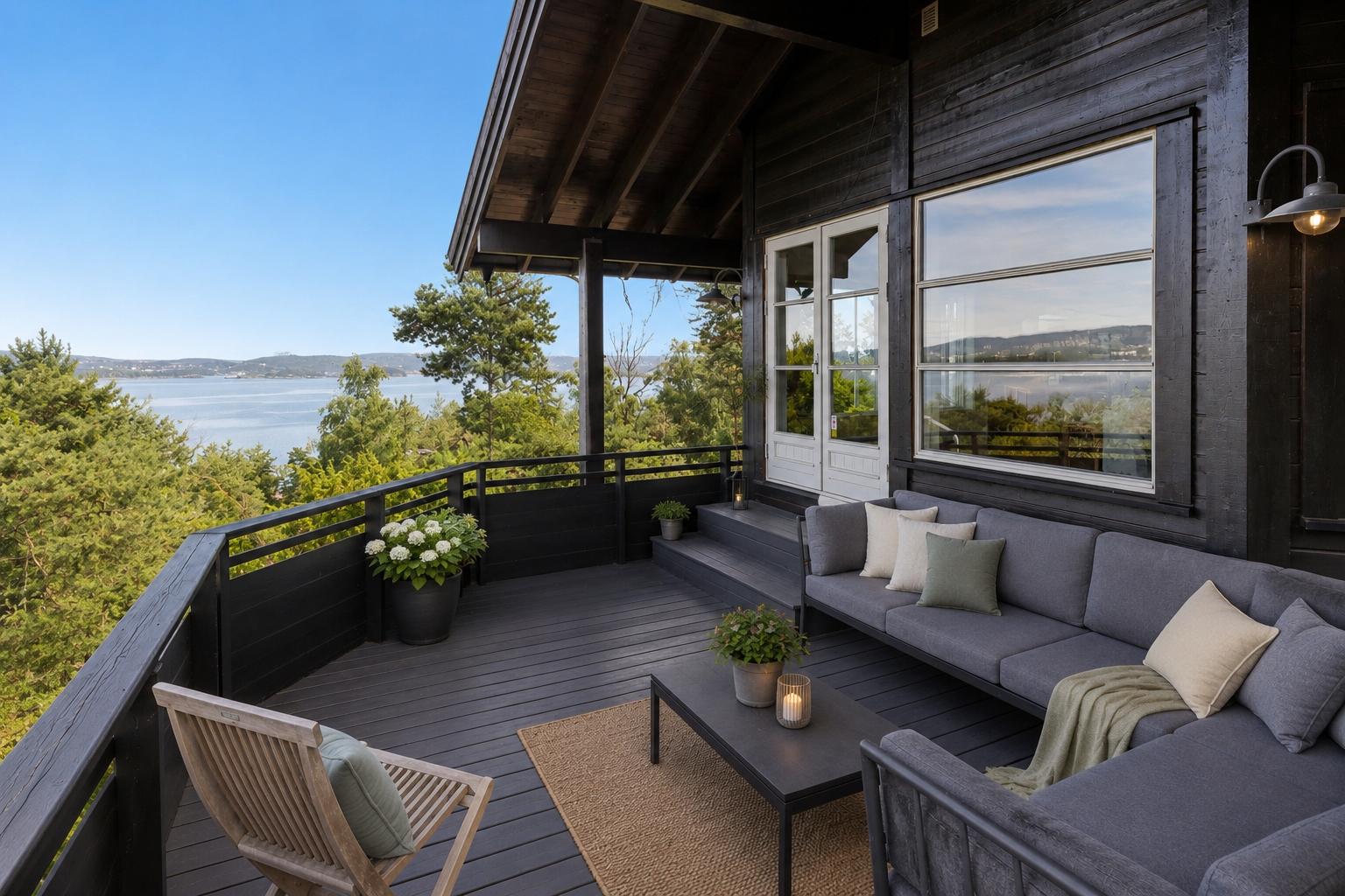 En av de store uteplassene, med god plass til sittegruppe og utsikt over fjorden. Bildet er digitalt stylet ved hjelp av AI, uten øvrige endringer i utforming, størrelse eller lignende. Galleribilde