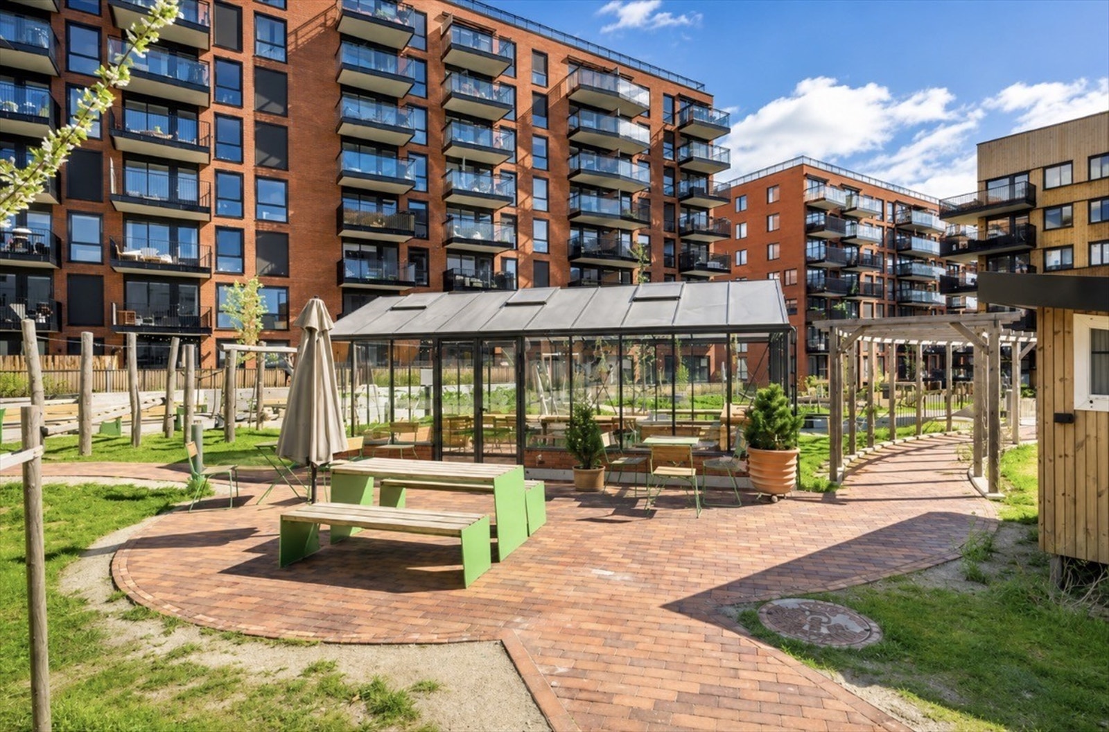 Nytt og moderne boligprosjekt med fasiliteter som takterrasse, drivhus, sykkelrom, hobbyrom og felleslokale Galleribilde