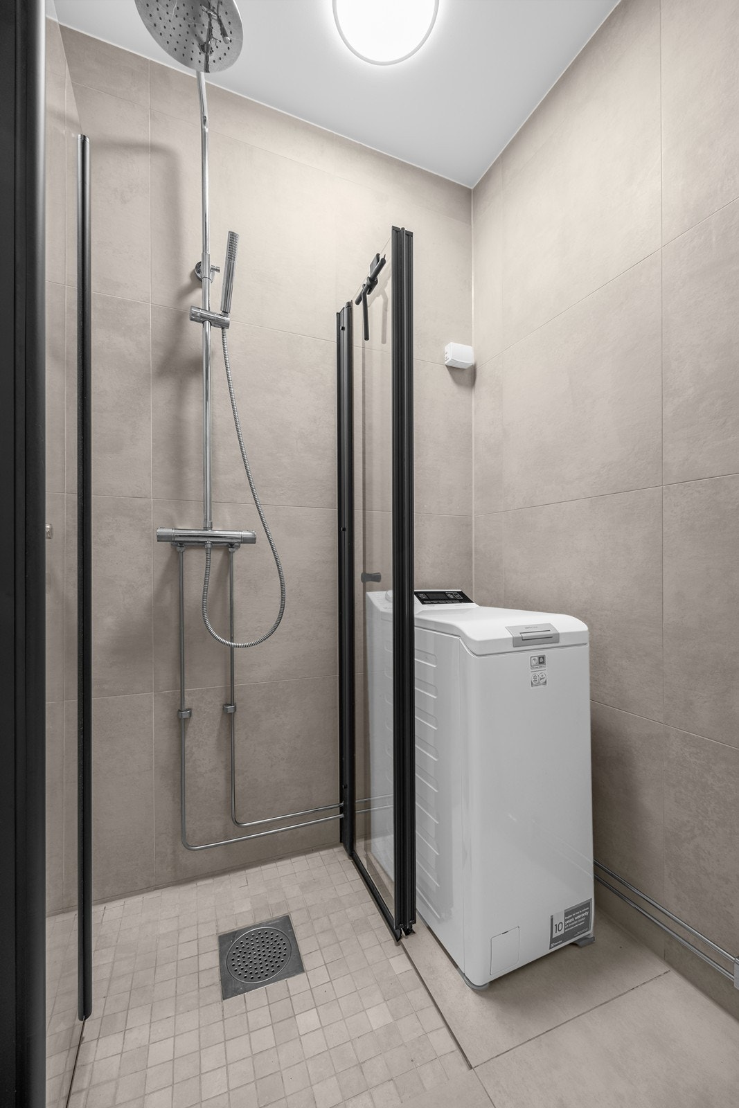 Badet har opplegg for vaskemaskin. Galleribilde