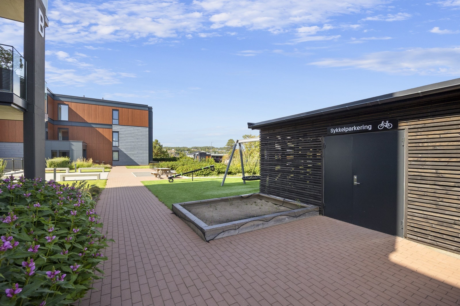 Sameiet har felles sykkelbod for beboerne. Galleribilde