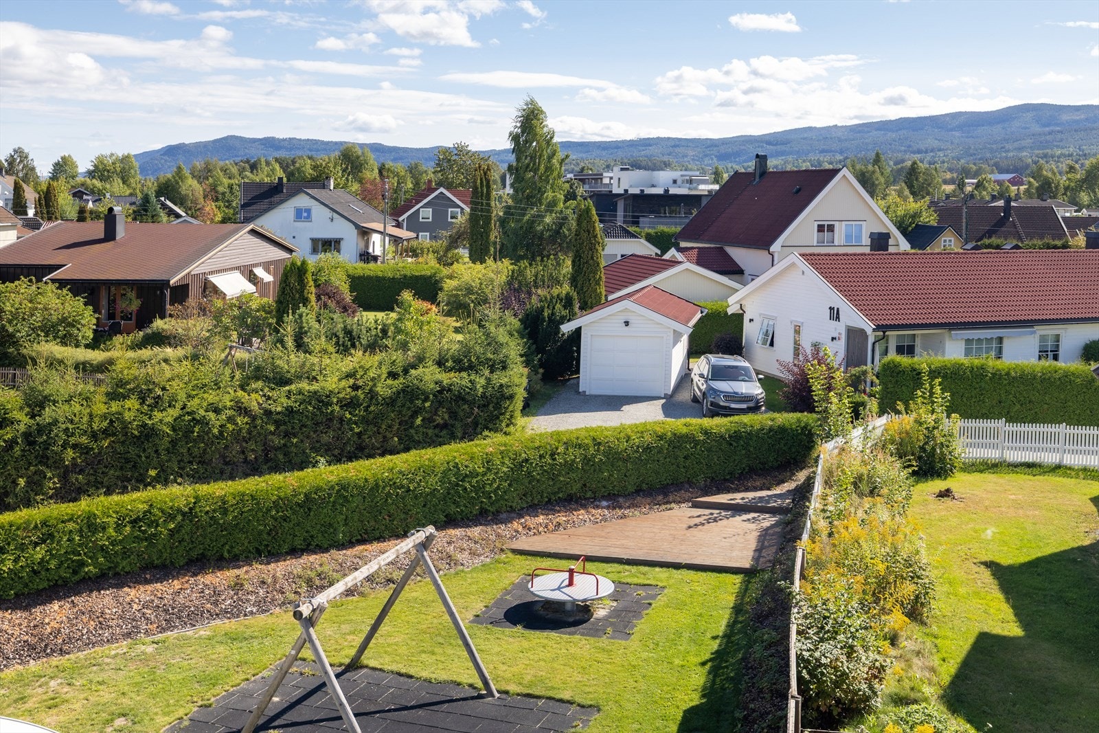 Trygge og barnevennlige fellesarealer i et rolig nabolag. Galleribilde