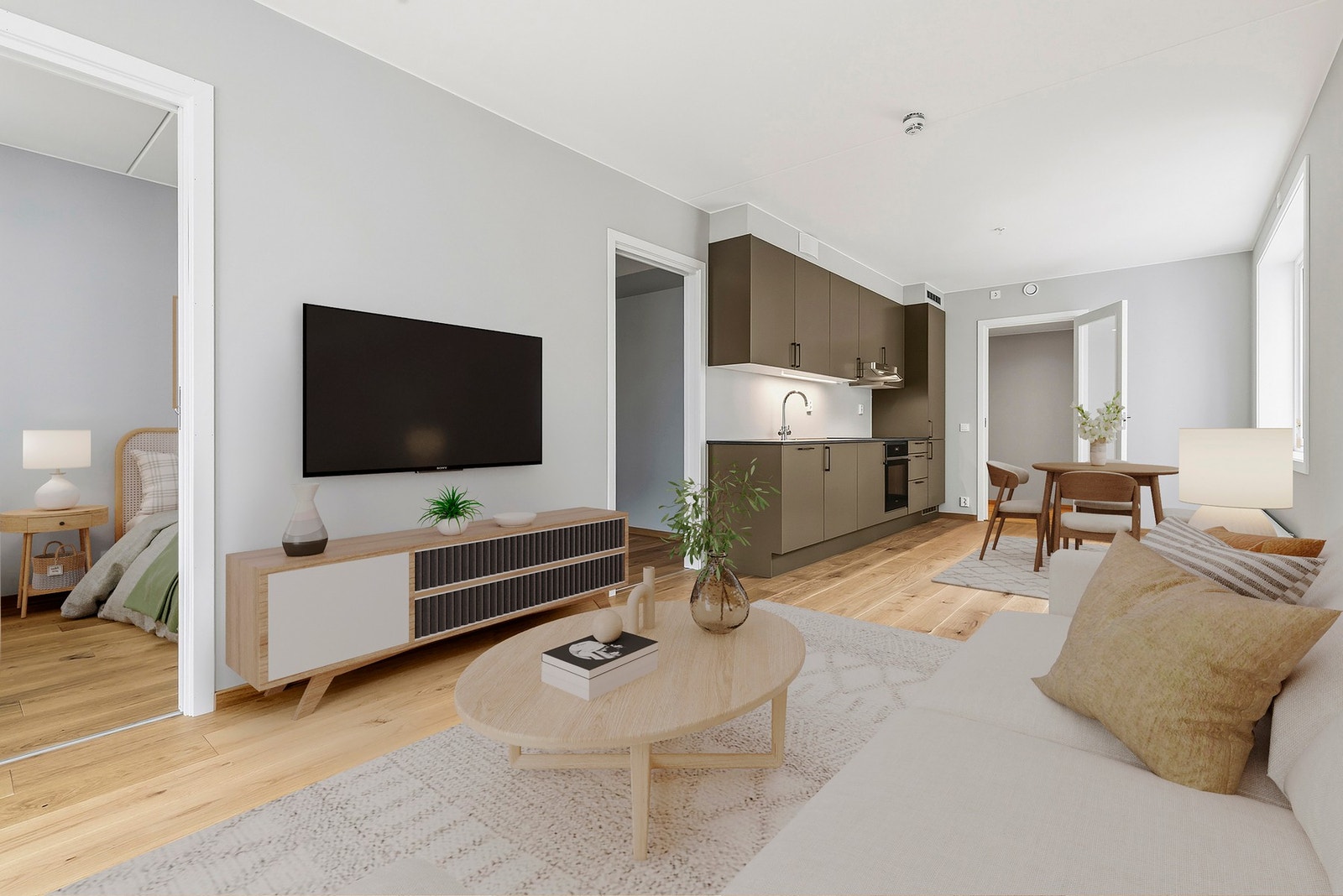Den åpne stue- kjøkkenløsningen understøtter leilighetens smarte planløsning.(Bildet er AI-generert med styling). Galleribilde