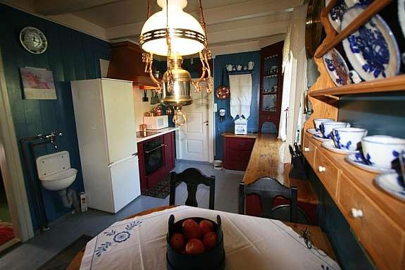 Koselig kjøkken i gjennomført stil Galleribilde