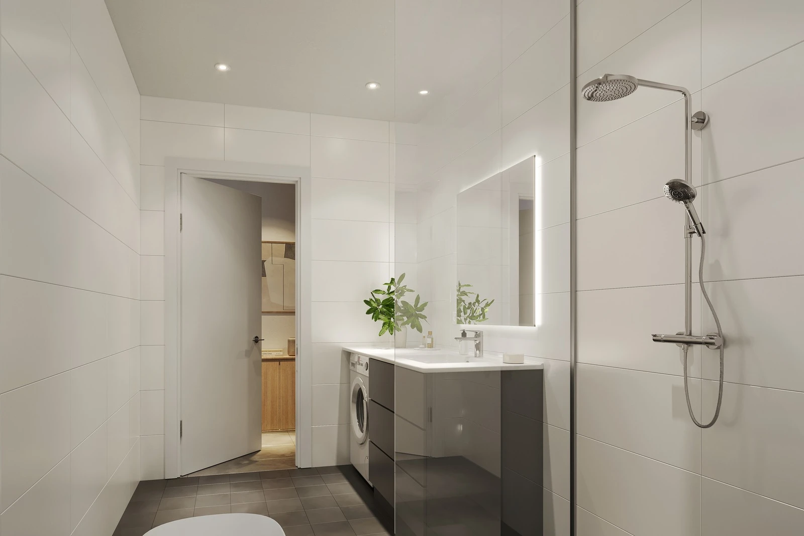 Delikat, flislagt bad med varme i gulv og spotter i tak. Galleribilde