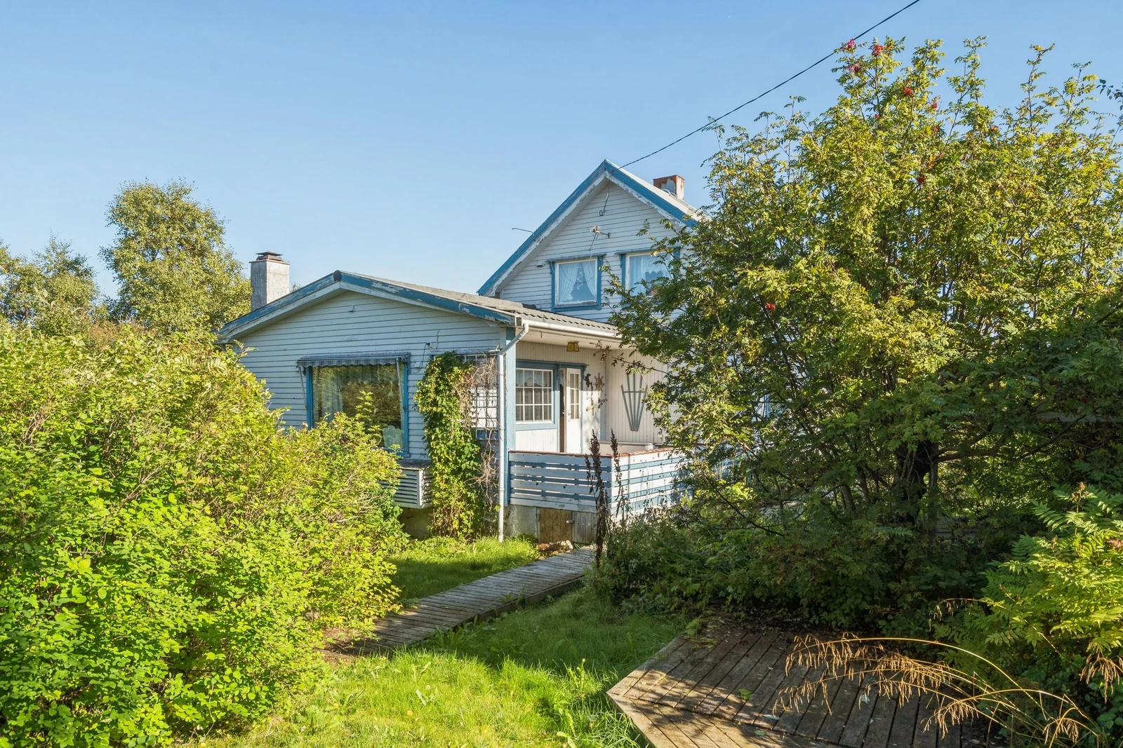 Fra hagen mot stue med innebygget veranda. Galleribilde