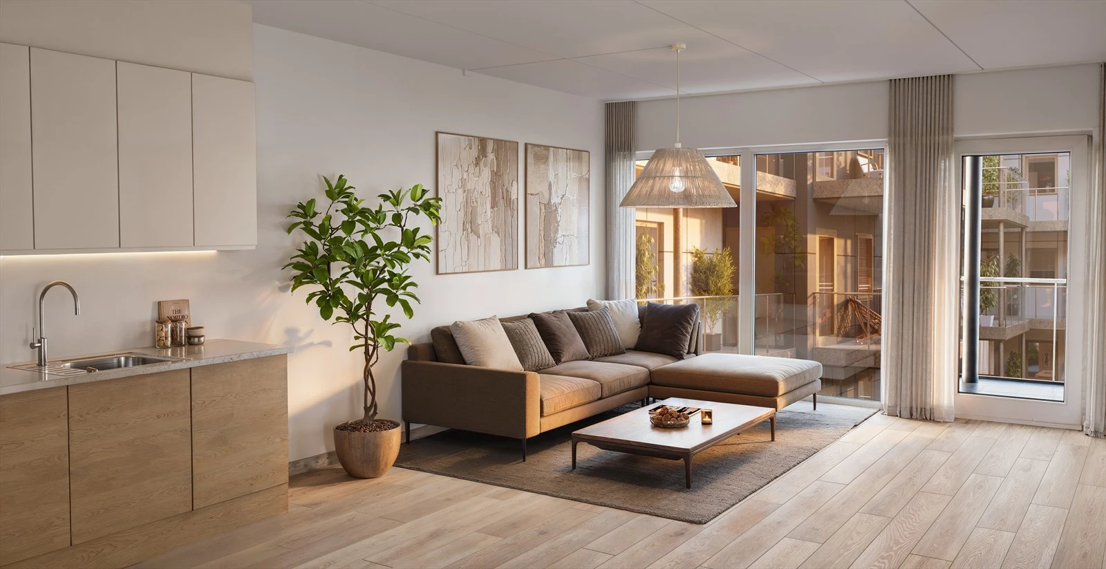 Åpen stue-kjøkken løsning med utgang til stor balkong.