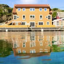 Røvær Kulturhotell AS logo