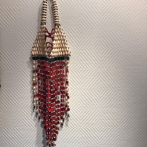 African bib necklace made of beads and shells in beautiful red, white and black.