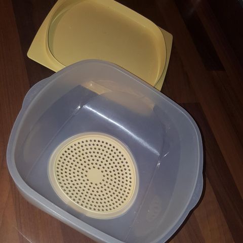 Osteklokke fra Tupperware .