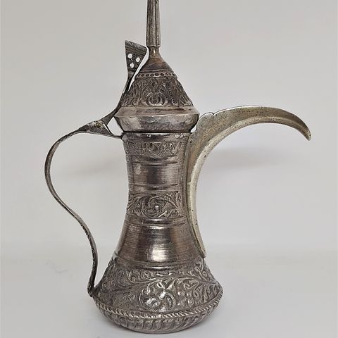 a beautiful example of an antique Omani bedouin silver dallah “دلة”
