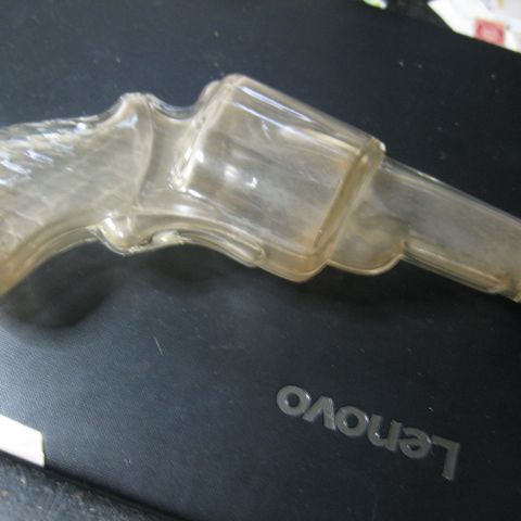 Lommelerke i Glass formet som Revolver