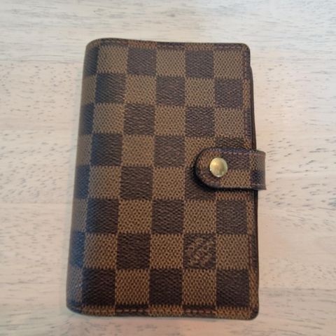 Louis Vuitton small ring agenda.