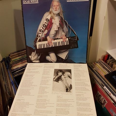 Edgar Winter standing on rock