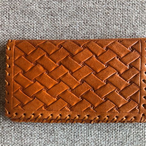Vintage lommebok i brunt skinn.
