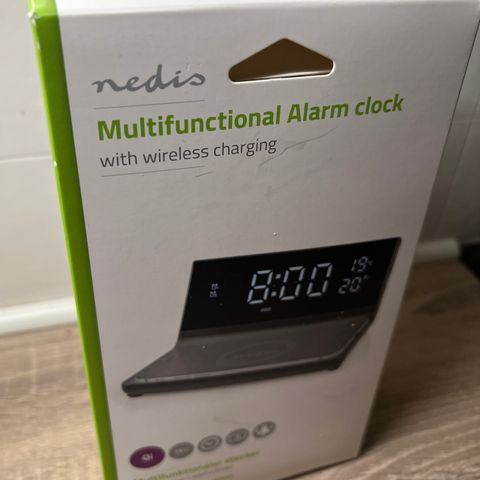 Ladeplate med alarm-klokke
