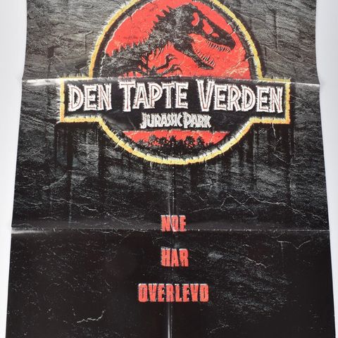 Plakat Jurassic Park           Den tapte verden.                Bud ønskes