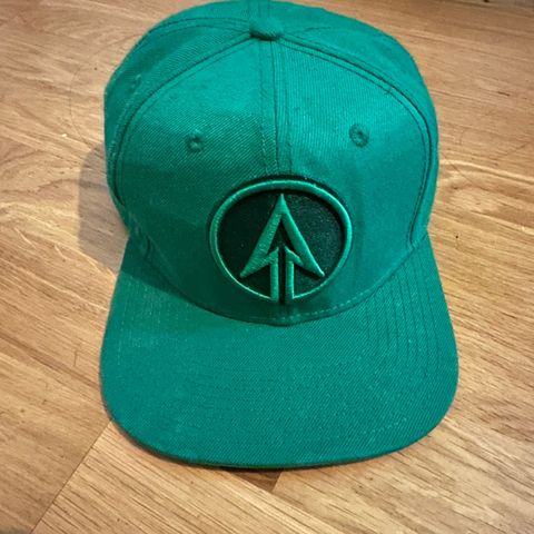 Ny Green arrow caps «intended for ages 14 and older»