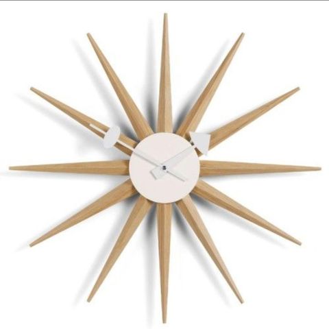 ØNSKES KJØPT. Vitra Sunburst veggklokke (eik)