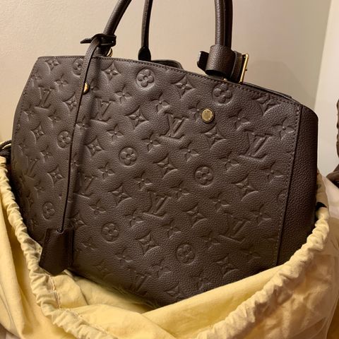 Reservert. Pent brukt Louis Vuitton Montaigne MM empreinte