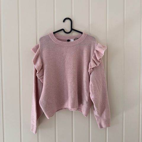 Selges nydelig rosa genser fra H&M