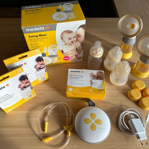 Medela Swing Maxi inkludert annet utstyr.