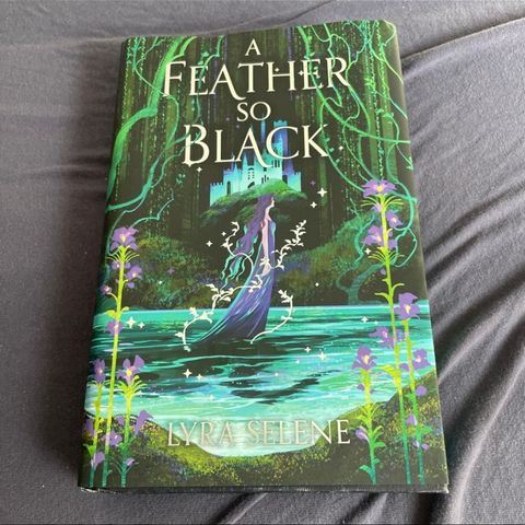 A feather so black av Lyra Selene