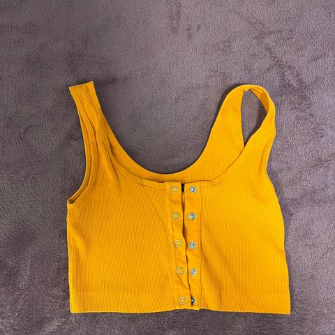 Selger oransje crop-top