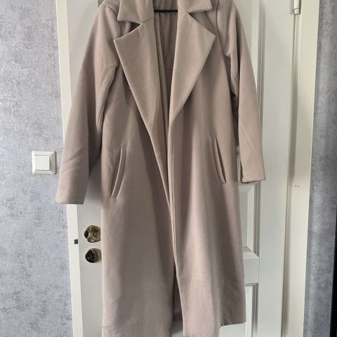 Almost as brand new long coat in beige color.