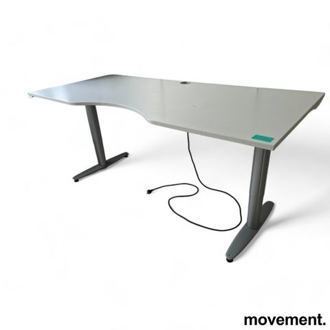 Skrivebord med elektrisk hevsenk i lys grå / grå fra Kinnarps, 200x90cm, magebue