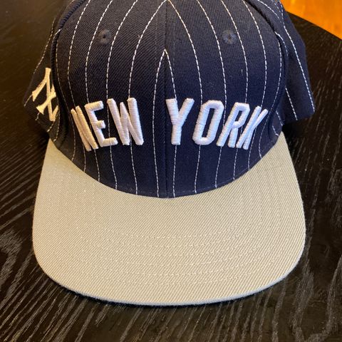 NY caps