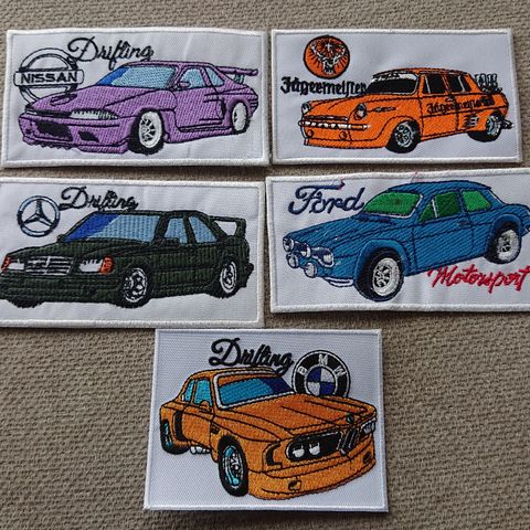 5 stk tøymerker BMW, Ford, Nissan, MB, VW selges