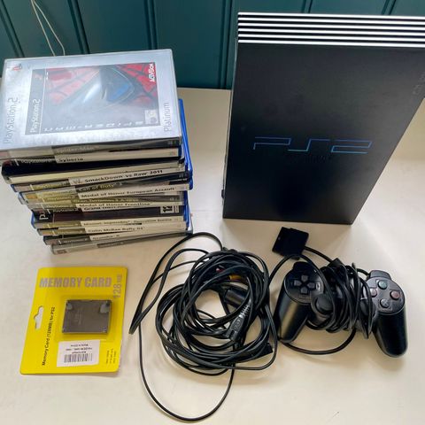 PS2 med tillbehør og 14 spill selges samlet.