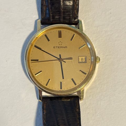 Eterna helgull klokke som ny m/original skinnreim