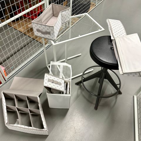 Ikea chair, little table and various boxes
