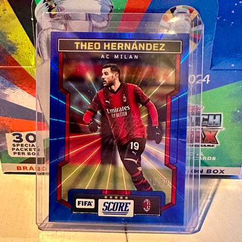 Theo Hernandez. Panini Score num 10/50 Blue Prizm.