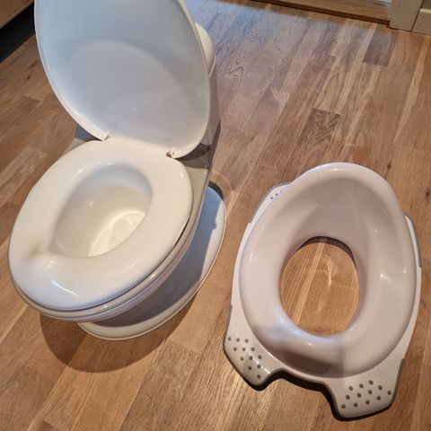 Toalettpotte med lyd samt seteinnlegg til toalett