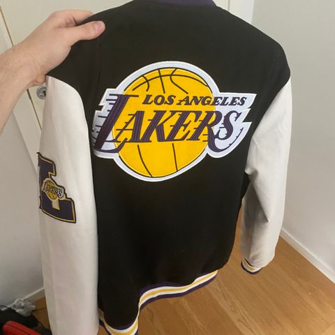 Los Angeles Lakers baseball jacket.