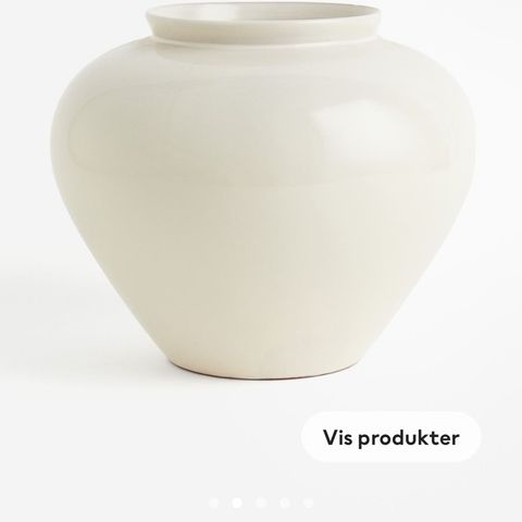 En rund vase fra glassert terrakotta