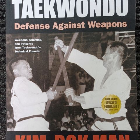 Taekwondo defense against weapons :   Kim , Bok Man