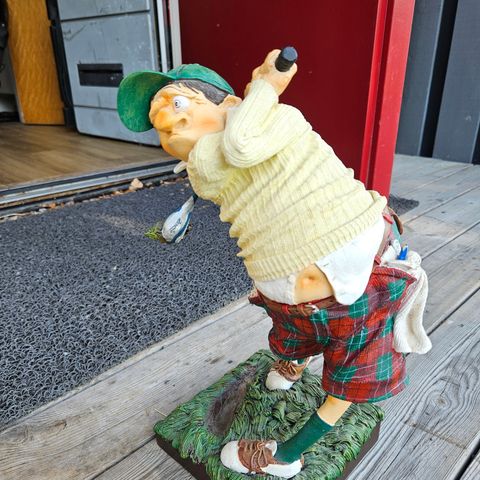 Statue av middelmådig golfspiller