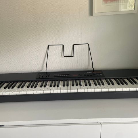 Roland RD-150 88 keys digital stage piano with stand, pedals and single speaker