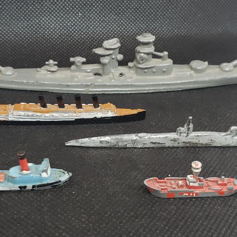 Scale die-cast waterline ship models.