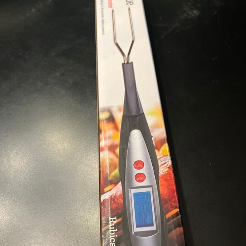 Barbecue fork with thermometer