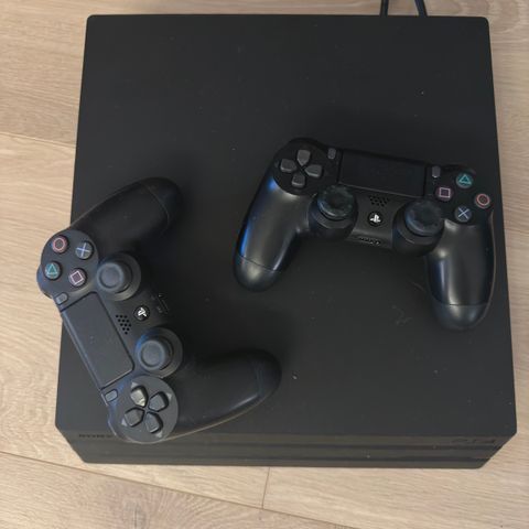 PlayStation 4 Pro med 11 spill