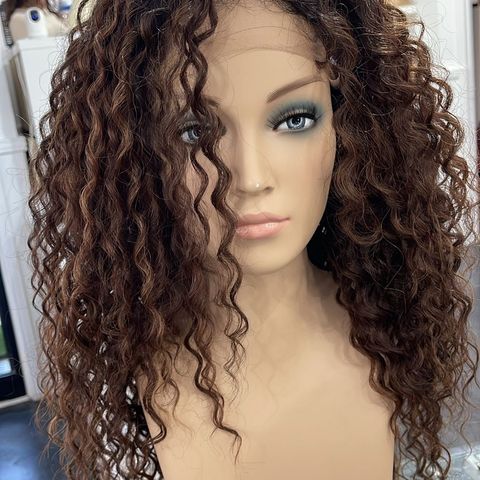 A heat resistant future fiber type of wig, curly hair with some slight highlight