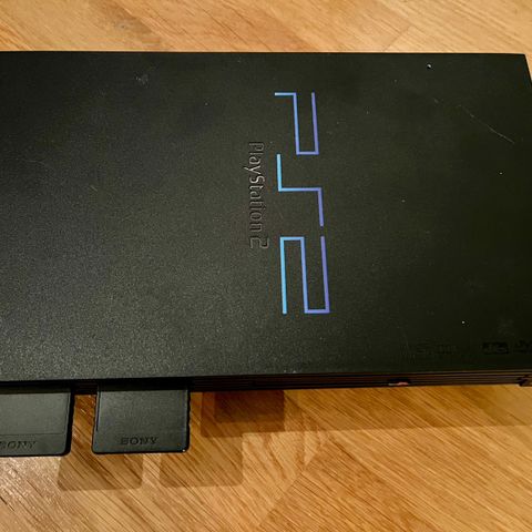 PlayStation 2 med tilbehør og 14 spill